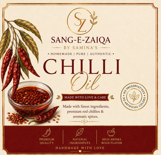 Front-facing packaging label for Sang-E-Zaiqa Chilli Oil, showing a bowl of red chili oil, scattered red chilies, and decorative text on a cream background with a dark red footer.