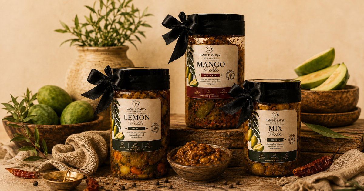 Three jars of mango aam ka achar pickles spices and chilies, including Lemon Rub, Mango Rub, and Mix Rub, styled on a rustic wooden surface with limes, herbs, and bowls against a warm beige background.