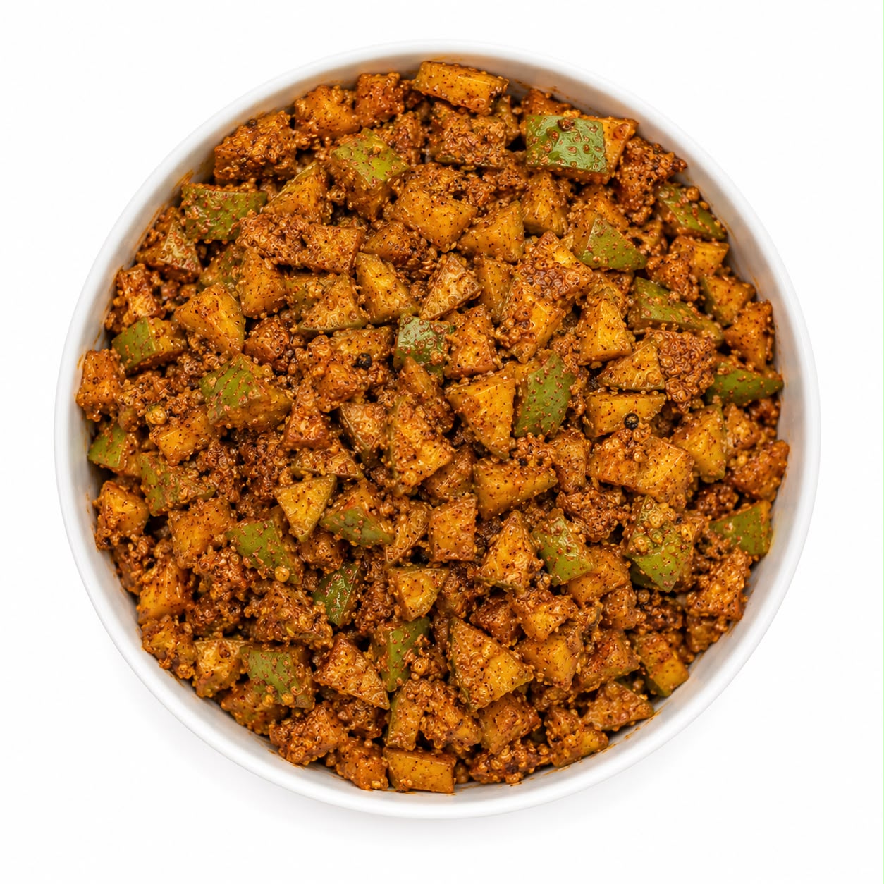 A top-down view of a white bowl filled with a textured, spiced food mixture containing diced yellow-orange vegetables and green pieces, isolated on a white background.